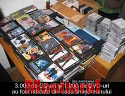 Descindere în apartamentul unui tânăr care vindea DVD-uri cu filme piratate