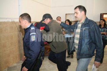 Polițistul Iftimie, escortat de colegii lui de la Arest
