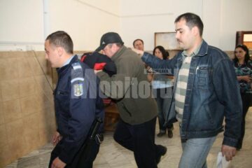 Polițistul Iftimie, escortat de colegii lui de la Arest