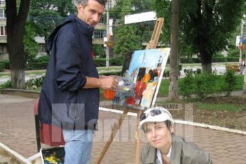 Carmel Georgescu și Ana Maria Ovadiuc, pictând în parc