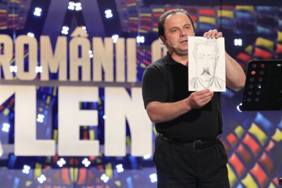 Sorin Ursan și desenul pe care l-a făcut în timp ce cânta. Foto: Adevarul.ro