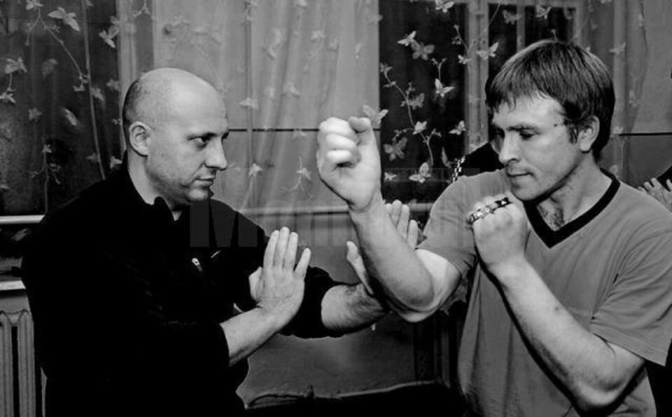 instructorul Ghenadie Ceban, stânga