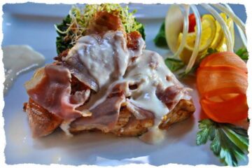 Duet din file de șalău și somon învelit în prosciutto crudo