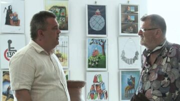Caricaturiștii Ovidiu Ambrozie Bortă BOA și Mihai Pânzaru PIM