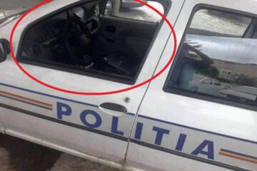 Polițist lovit cu un bolovan, prin geamul mașinii de serviciu, în timpul urmăririi unui suspect