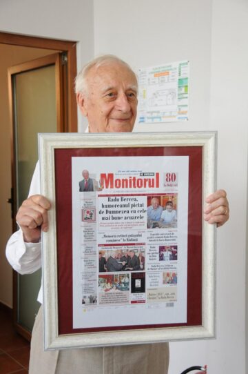 Conducerea ziarului Monitorul i-a oferit maestrului o machetă a primei pagini a cotidianului
