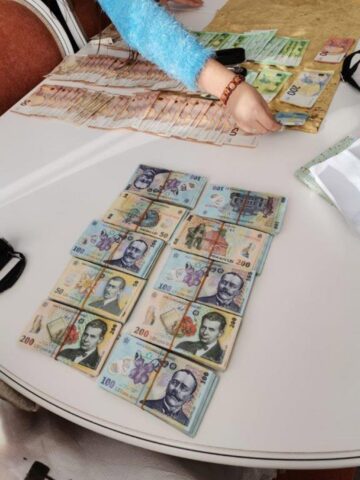 Bani confiscați la percheziții