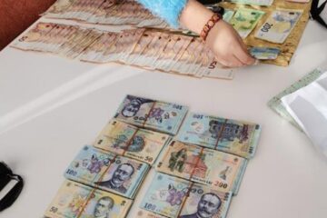 Bani confiscați la percheziții